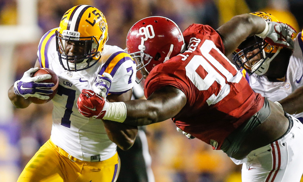 Alabama DT Jarran Reed (#90) grabs RB Leonard Fournette in 2015 game versus LSU