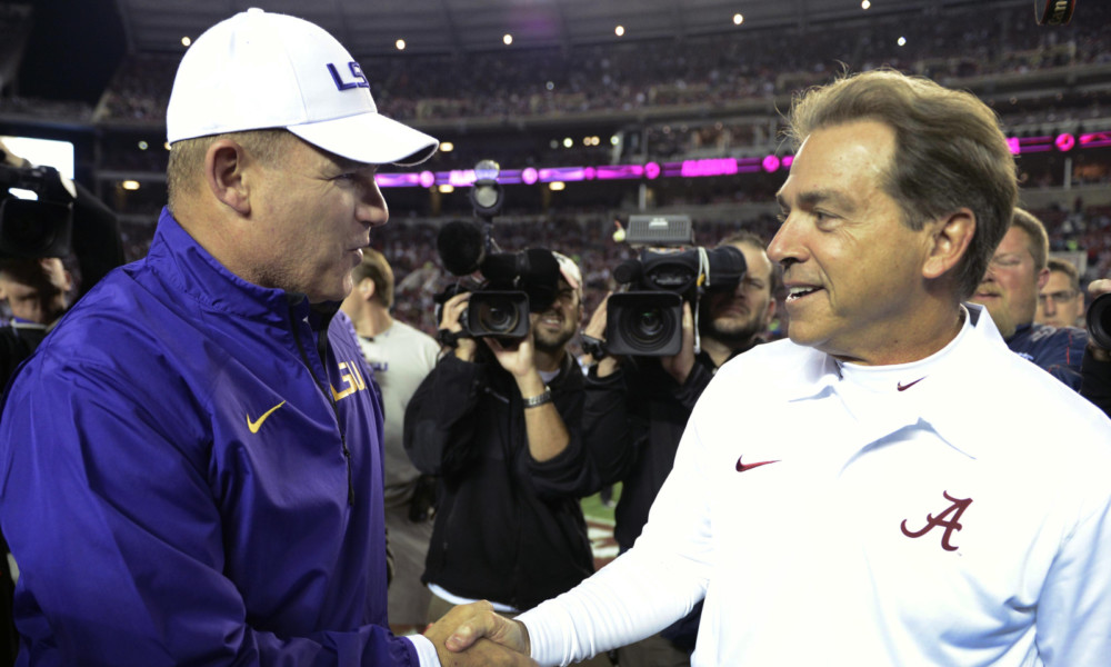 nick saban and les miles shaking hands