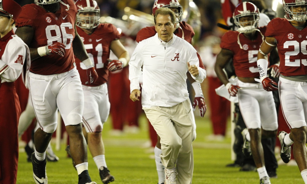 Nick Saban running on the field