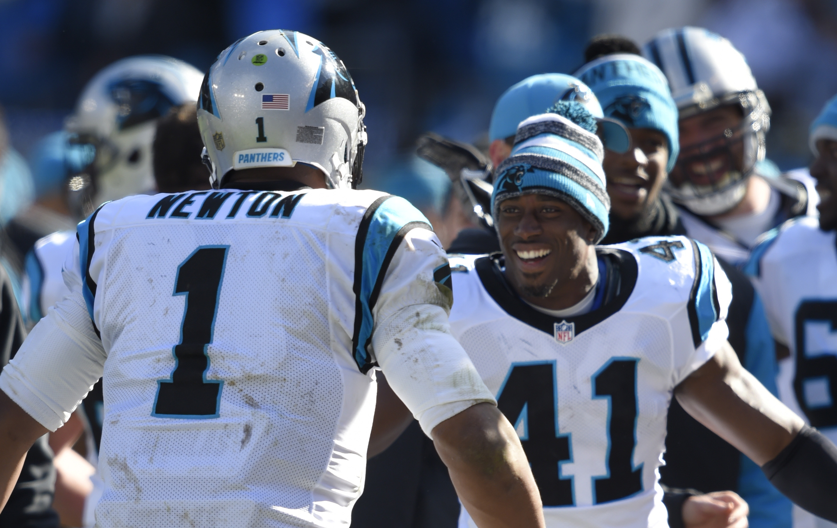 Cam Newton and Roman Harper