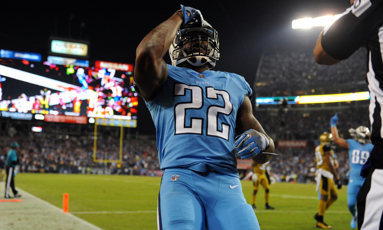 Derrick Henry of the Tennessee Titans rushes in the first half of