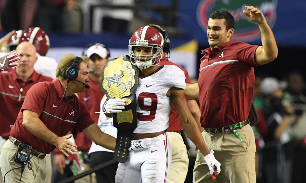 Alabama safety Minkah Fitzpatrick (#29) hold "Ball Out" turnover belt after recording a pick-six in 2016 SEC Championship Game versus Florida.