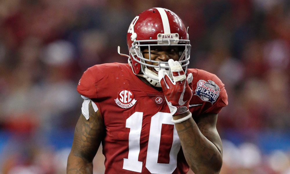 Reuben Foster (#10) leading Alabama's defense to victory over Washington in 2016 Chick-fil-A Peach Bowl