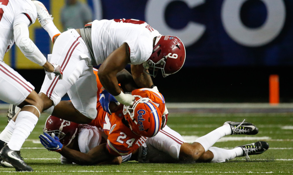 Da'Shawn Hand (#9) tackles a Florida running back with Minkah Fitzpatrick (#29) in 2016 SEC Championship Game