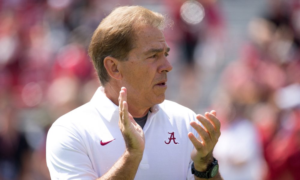 Alabama football head coach Nick Saban clapping at a game in 2017