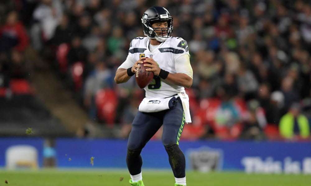 Russel Wilson throwing a pass in London