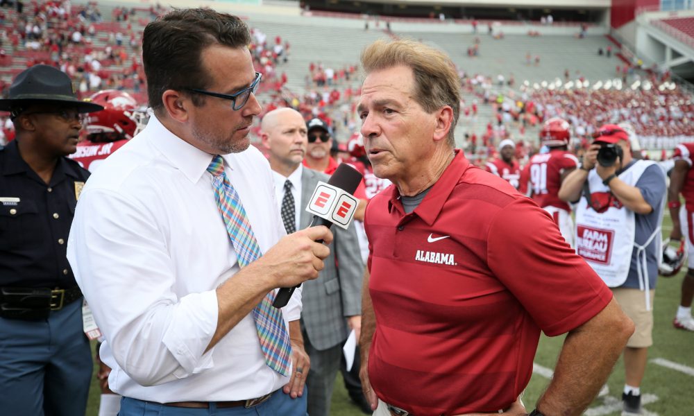 Alabama HC Nick Saban talking to ESPN's Tom Luginbill after a game in 2018