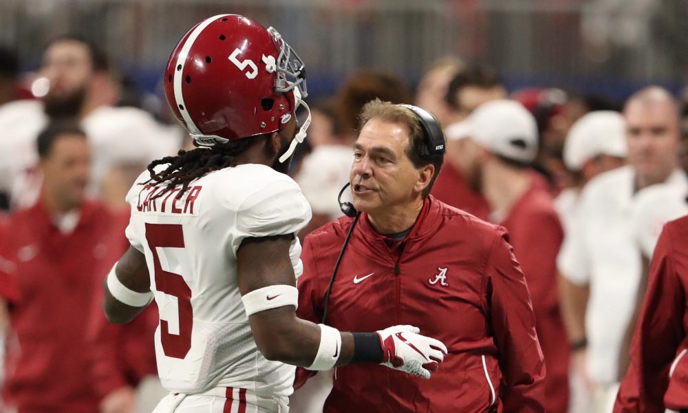 Nick Saban coaching Shyheim Carter on the sideline during 2018 SEC Championship between Alabama and Georgia