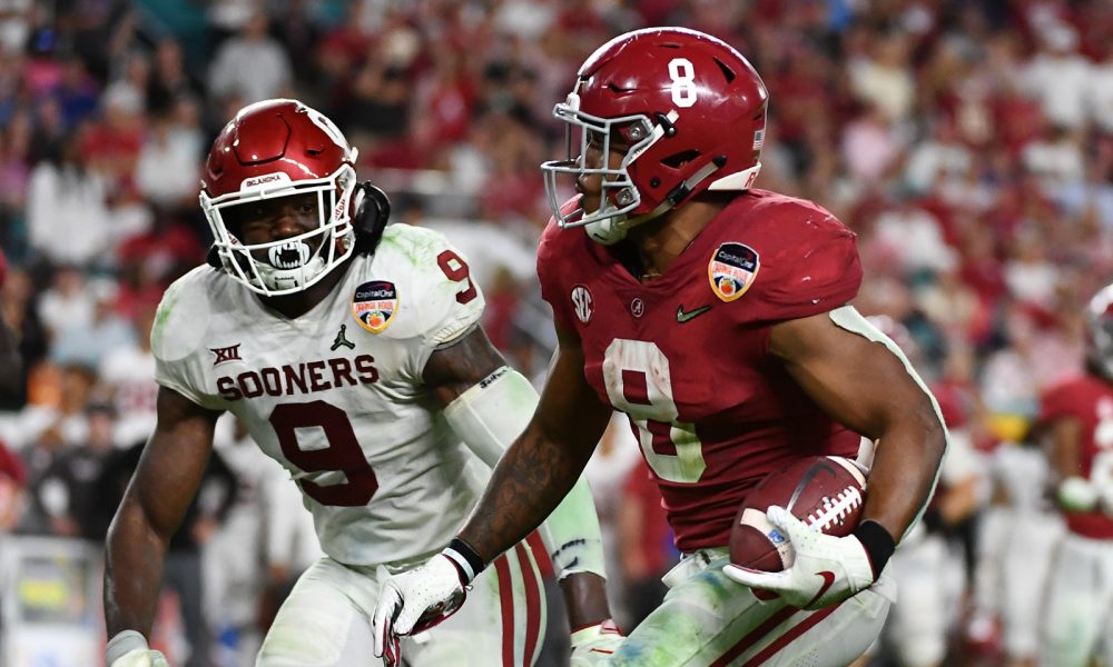 Josh Jacobs (No. 8) runs with the football for Alabama versus Oklahoma in 2018 CFP semifinal