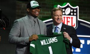 Quinnen Wiliams holding jersey with Roger Goodell