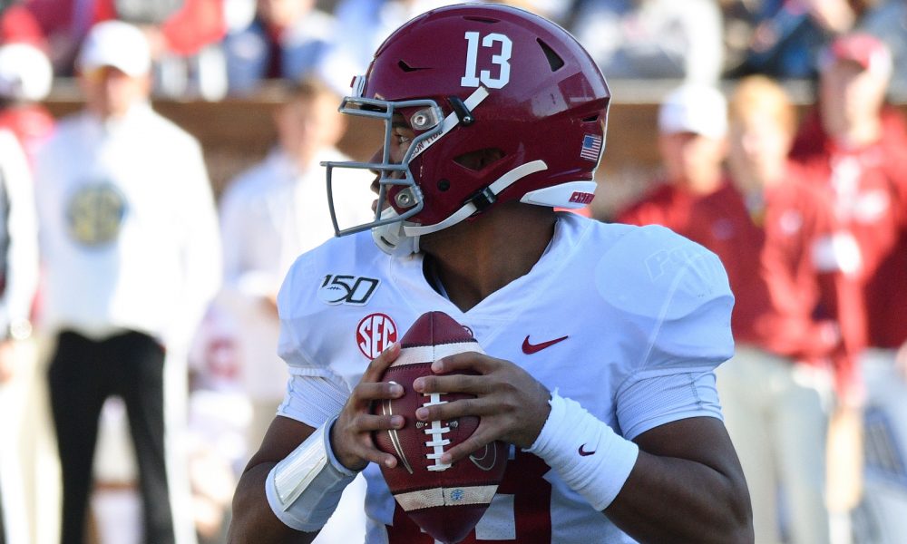 Tua Tagovailoa holding the ball during a matchup versus Miss. State in 2019