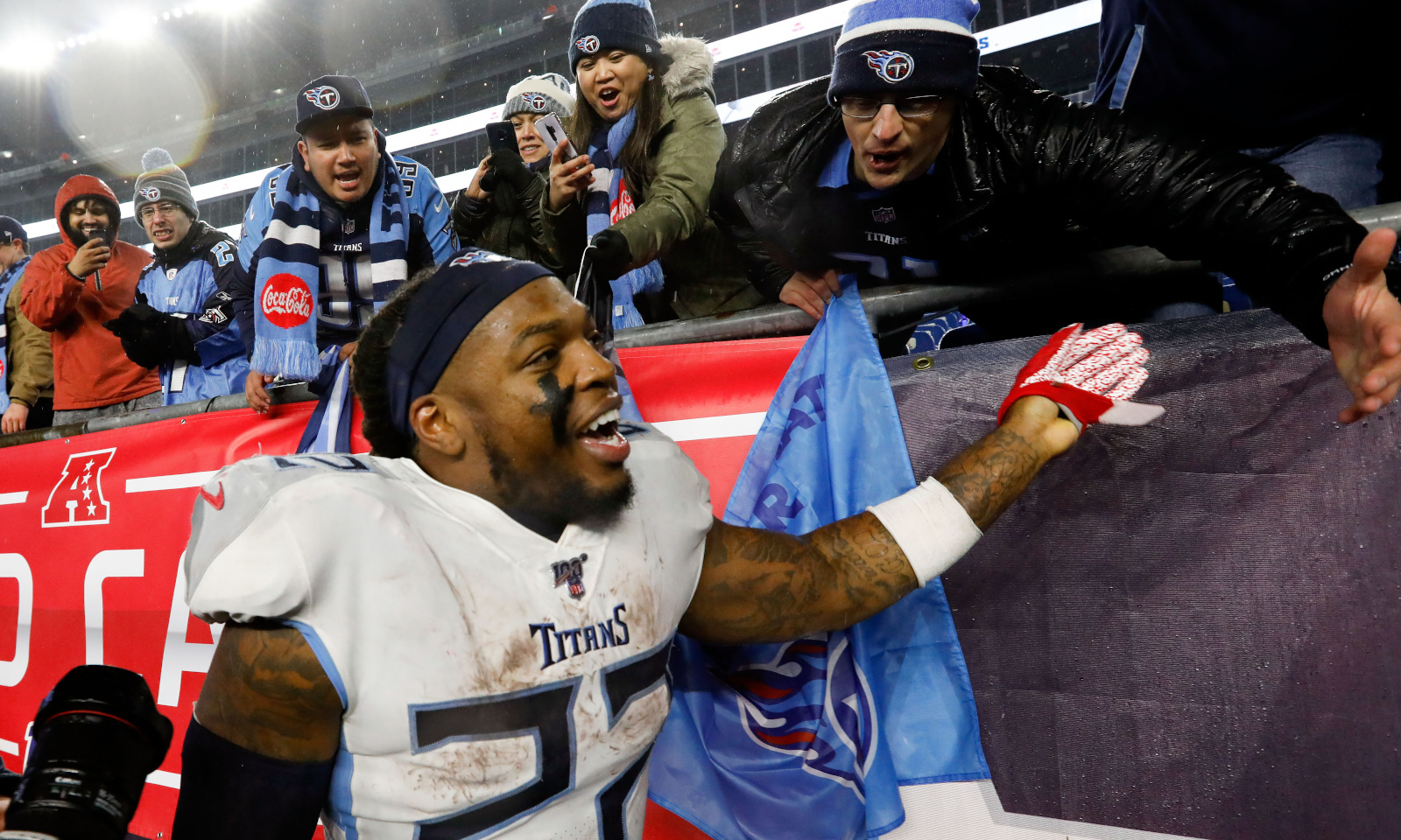 Tennessee Titans running back Derrick Henry celebrates with fans after a win