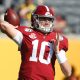 Mac Jones attempting to throw a pass versus Michigan in the Citrus Bowl