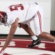 Shambre Jackson posing for picture in defensive line stance during visit to the University of Alabama