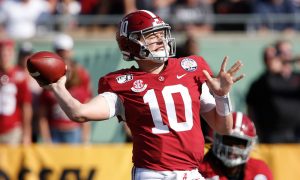 Mac Jones throwing the football