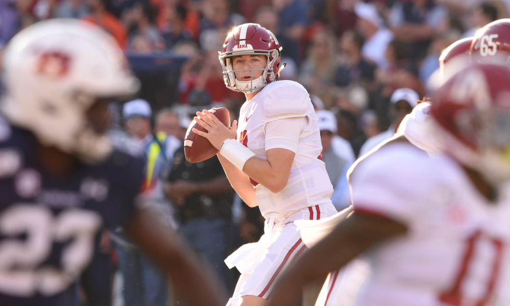 Mac Jones attempting a pass versus Auburn in 2019 Iron Bowl matchup