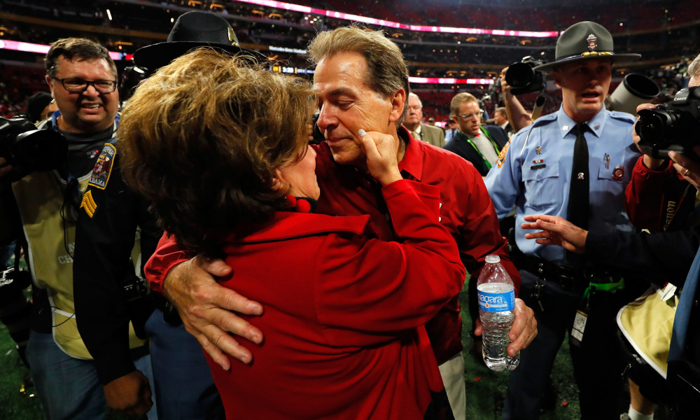 Terry Saban pinches Nick Saban's cheek after 2018 SEC Championship Game