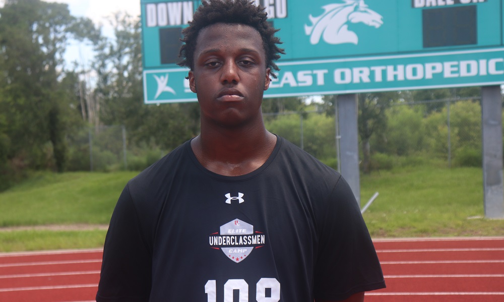 Derrick Leblanc poses for picture at football camp