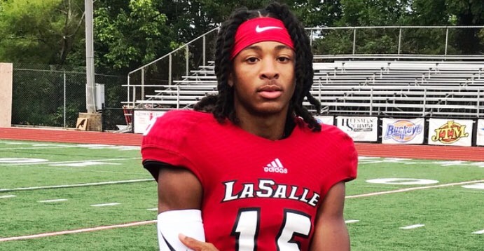 Devonta Smith posing for picture in La Salle uniform