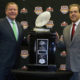 Nick Saban and Brian Kelly posing with the 2012 BCS National Championship Trophy