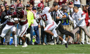 Jaylen Waddle (No. 17) runs for a touchdown in Alabama's 2019 game versus Texas A&M
