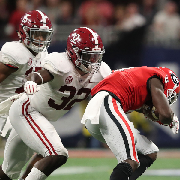 Dylan Moses of Alabama tackles Georgia player in 2018 SEC Championship Game