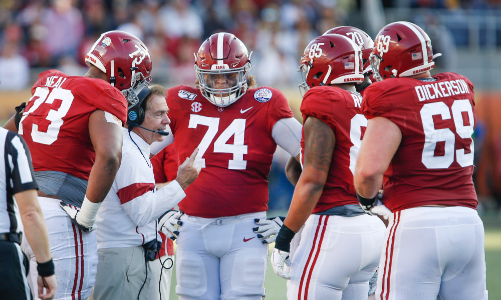Nick Saban talking to Alabama's offensive line during a time out at the Citrus Bowl