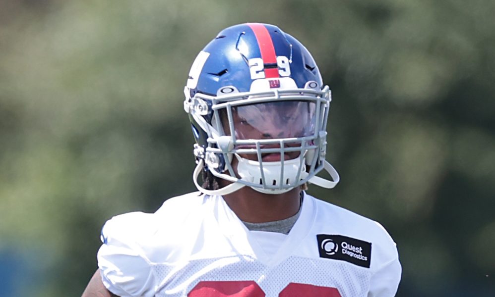 Xavier McKinney jogs to the sideline during Giants training camp