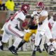 Bryce Young hands the ball off to trey sanders