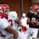Bryce Young attempting to throw a pass at Alabama fall practice