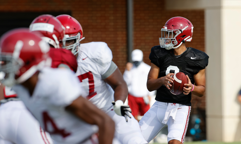 Bryce Young attempting to throw a pass at Alabama fall practice