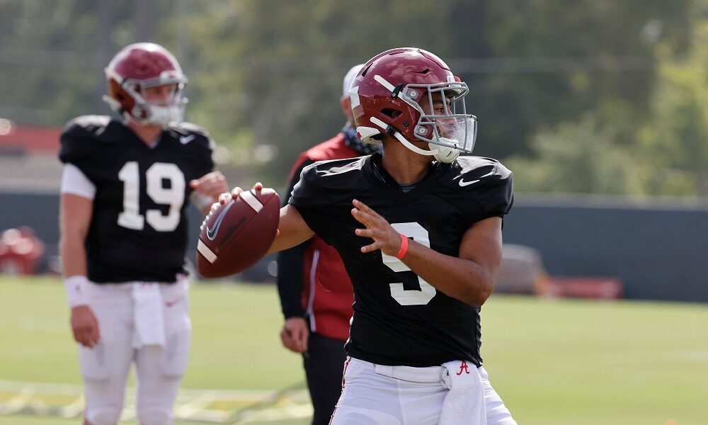 Bryce Young attempts a pass in 2020 fall camp for Alabama