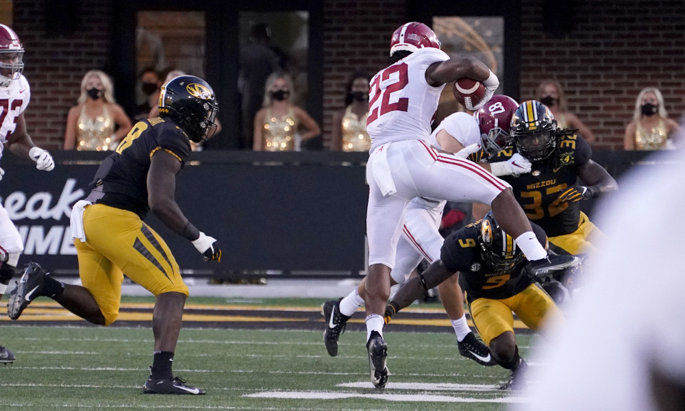 Najee Harris hurdles a Missouri defender