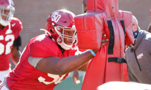 Tim Smith (No. 50) working the sled at Alabama at practice