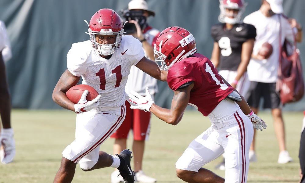 Traeshon Holden runs the football during Alabama football fall camp