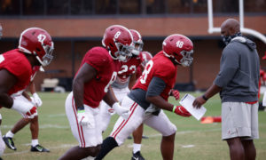 Freddie Roach, Alabama DL coach, working with his group at practice