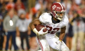 Alabama running back Najee Harries carries the football