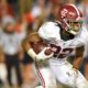 Alabama running back Najee Harries carries the football