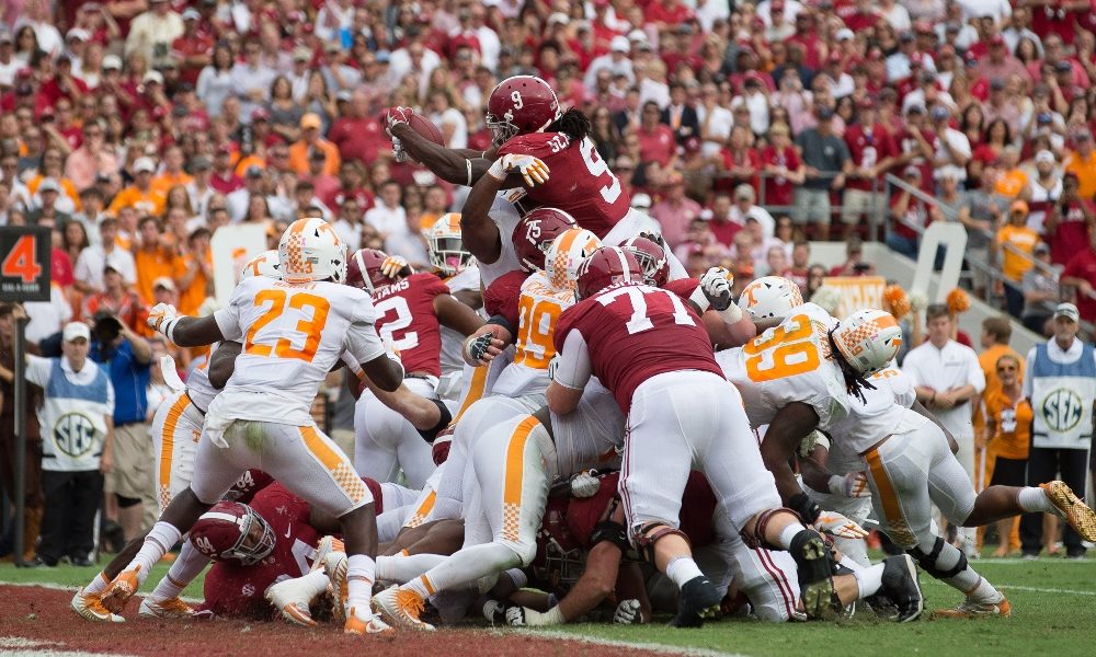 Bo Scarbrough leaps over the goal line against Tennessee