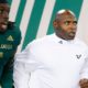 Charlie Strong leads USF out of the tunnel