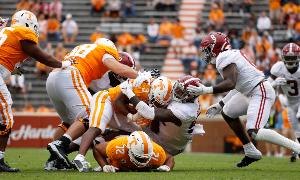 Christian Barmore (No. 58) tackles Tennessee RB, Eric Gray