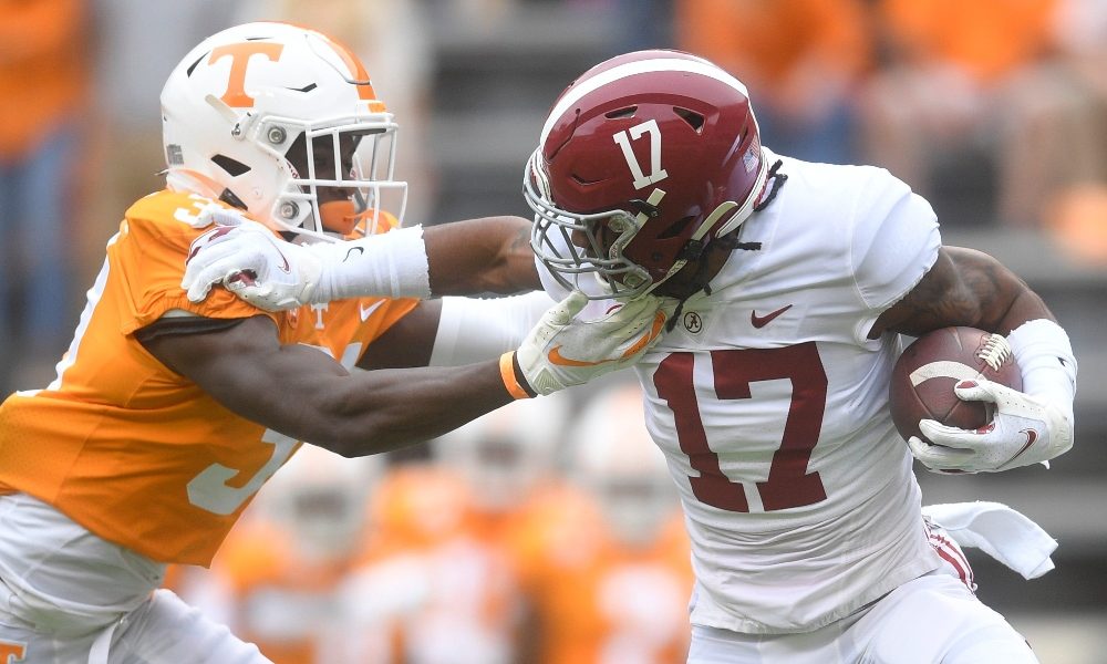 Jaylen Waddle is tackled by a member of Tennessee