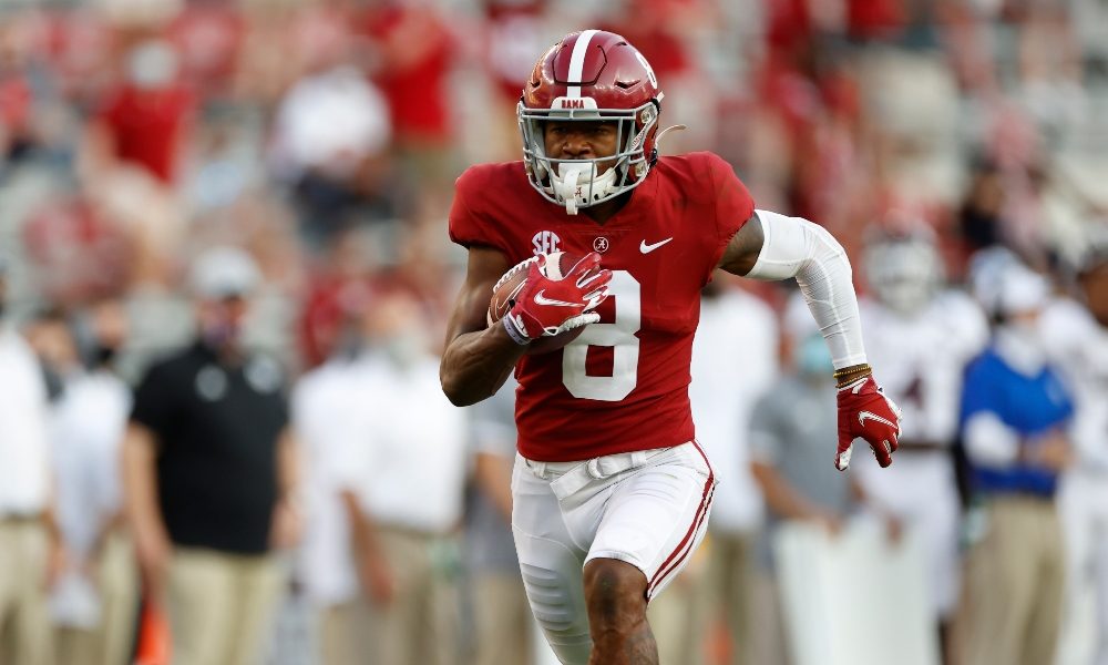 John Metchie runs after the catch against Texas A&M