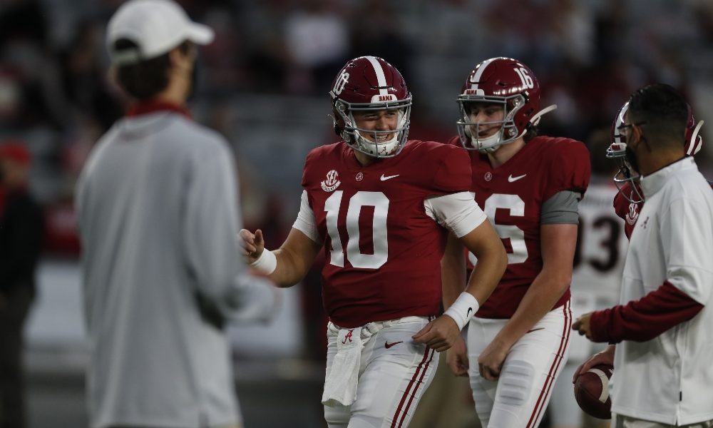 Mac Jones smiling next to kicker Will Reichard