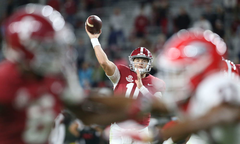 Mac Jones throws a pass to John Metchie versus Georgia