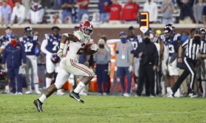 Alabama running back najee harris runs free in the open field against the Ole Miss Rebels