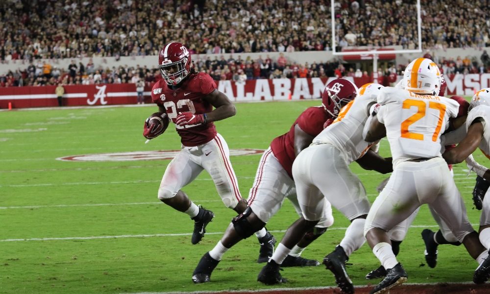 Najee Harris runs into the endzone against Tennessee