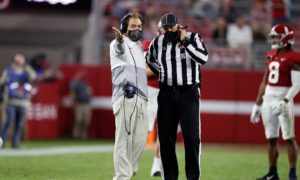 Nick Saban talks to the official