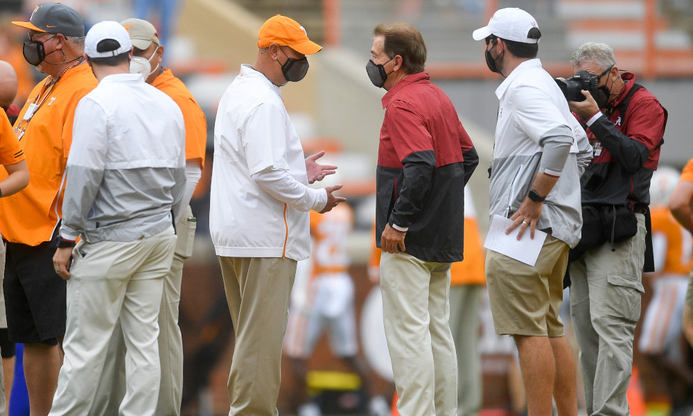 Nick Saban and Jeremy Pruitt shake hands in pregame