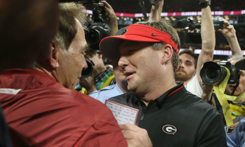 Nick Saban and Kirby Smart meet at midfield after 2018 SEC Championship Game